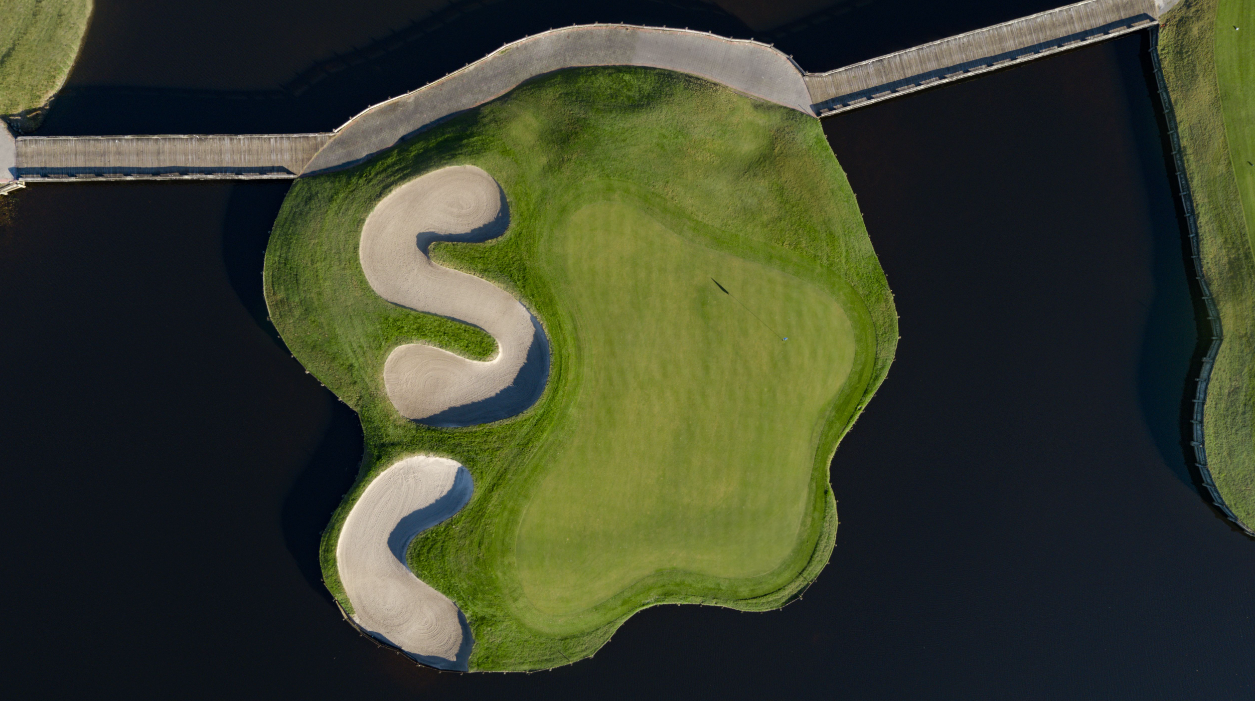 Aerial view of island golf green with bunkers