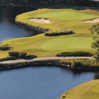 Island green golf course with water and bunkers
