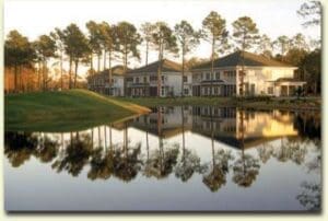 Lakeside houses with tree reflections
