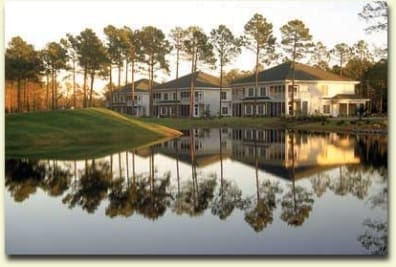 Lakeside houses with tree reflections